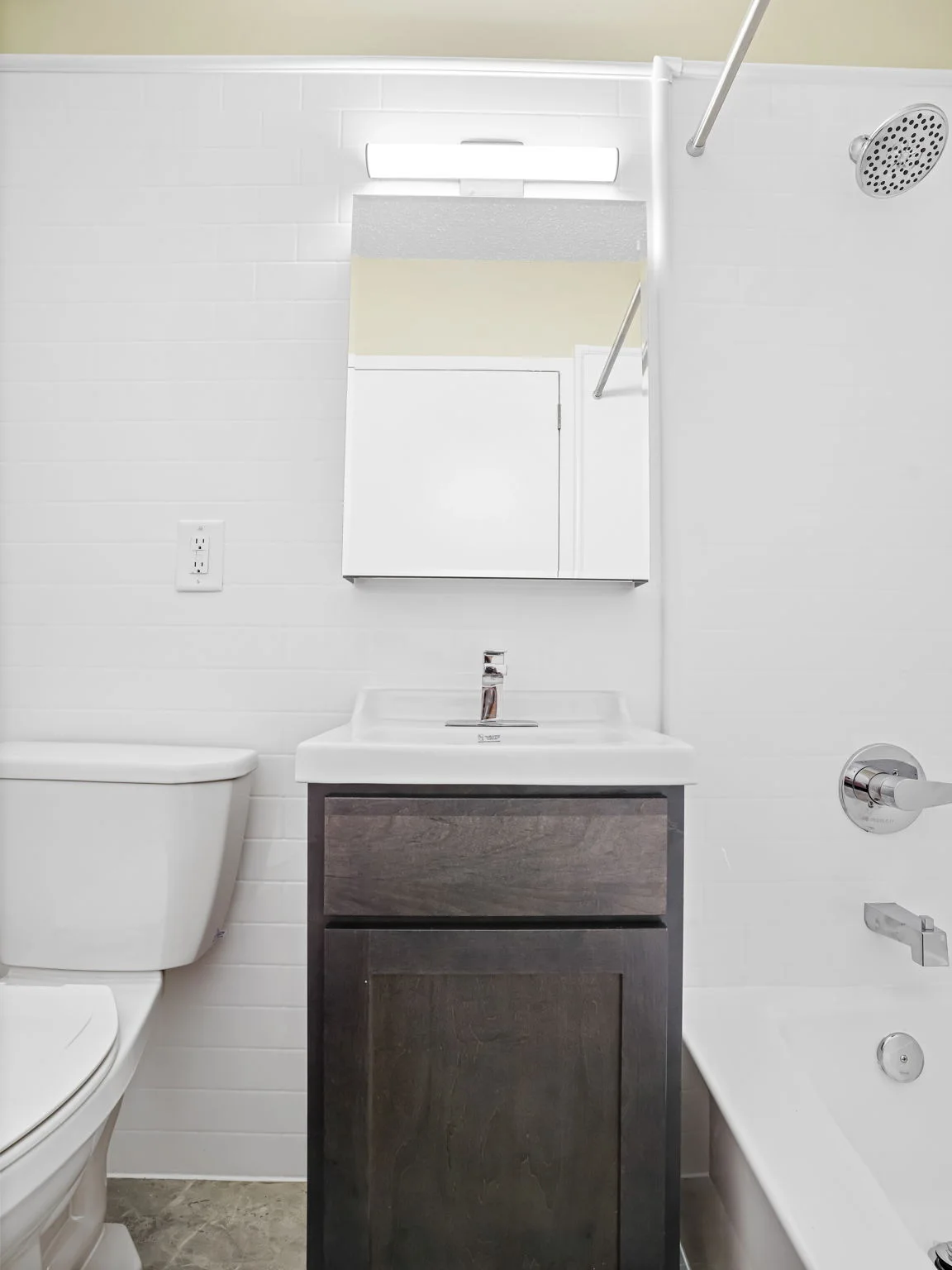 Completed compact multifamily bathroom supplied by Tindel