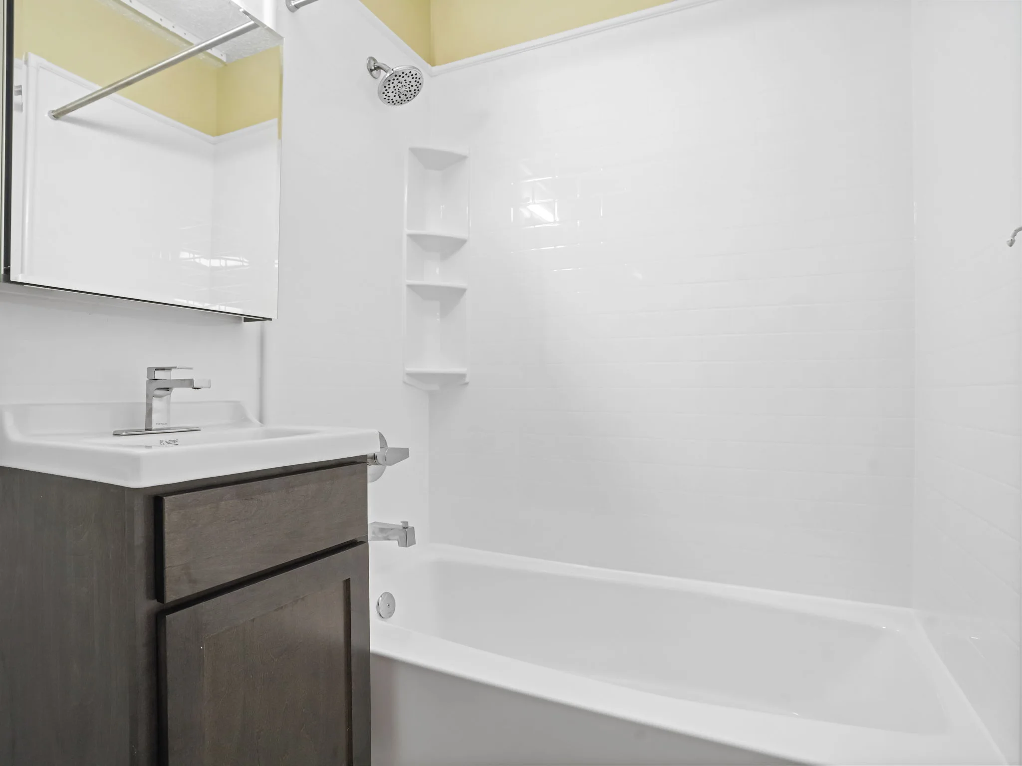 Completed bath with a seamless white acrylic wall system
